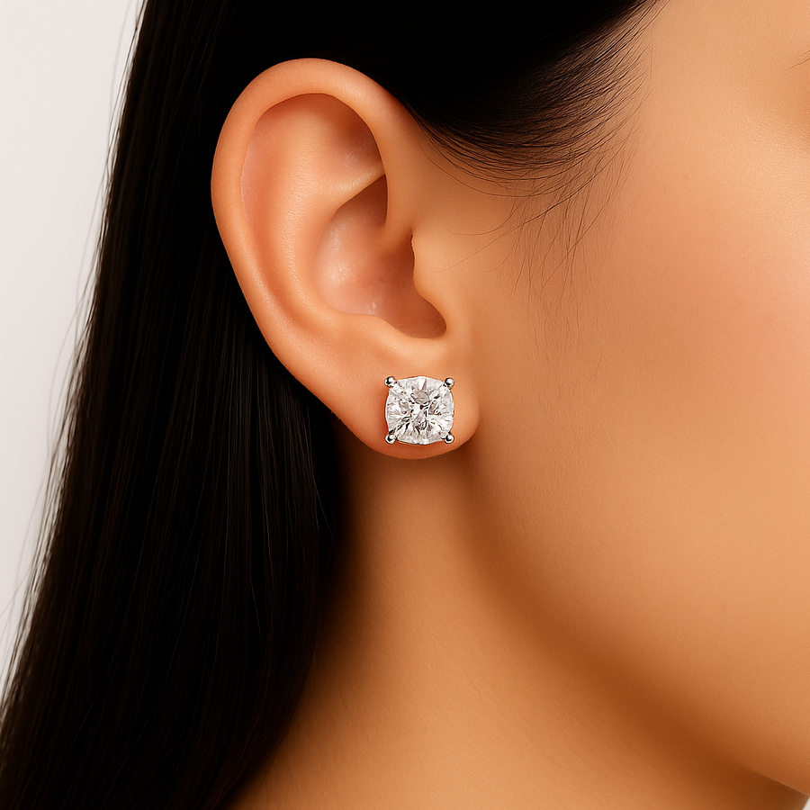 Cushion cut moissanite stud earring on ear close-up view