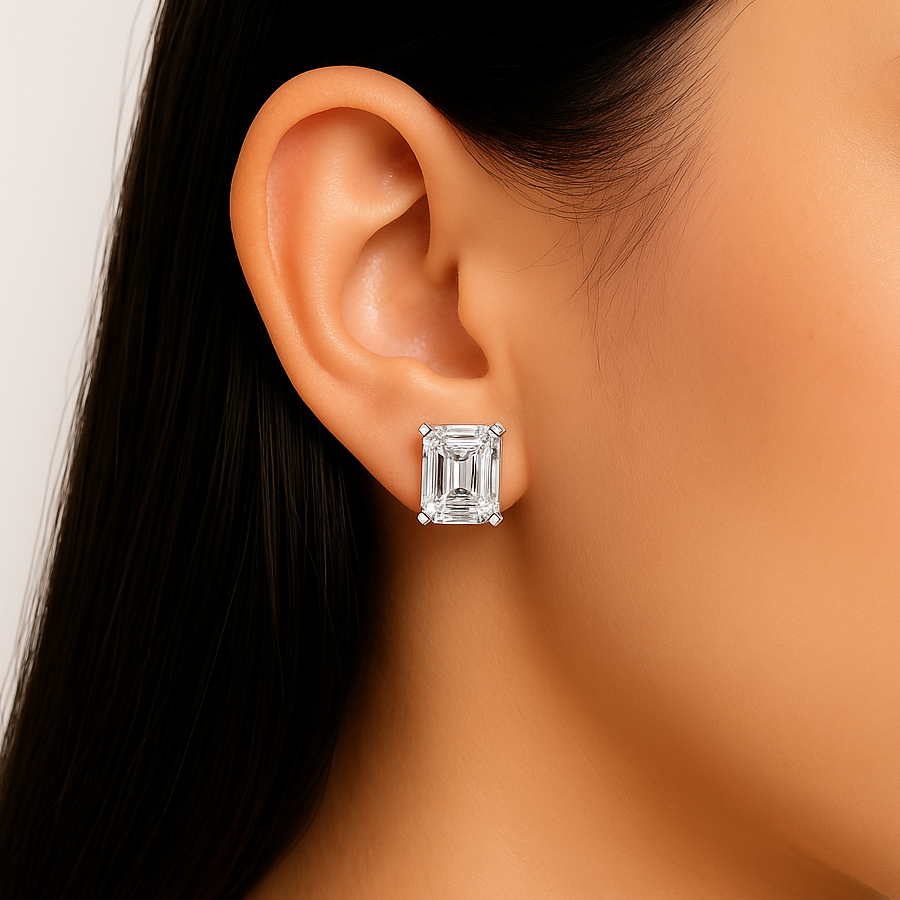 Emerald cut moissanite stud earring on ear close-up view