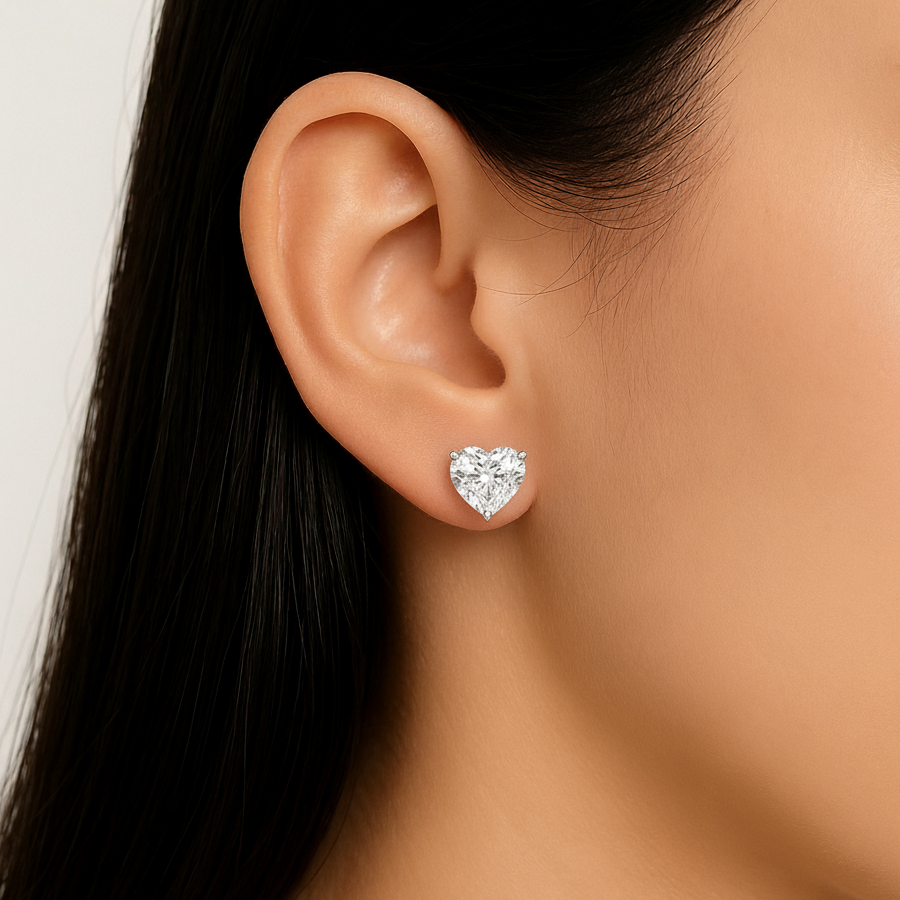 Heart cut moissanite stud earring on ear close-up view
