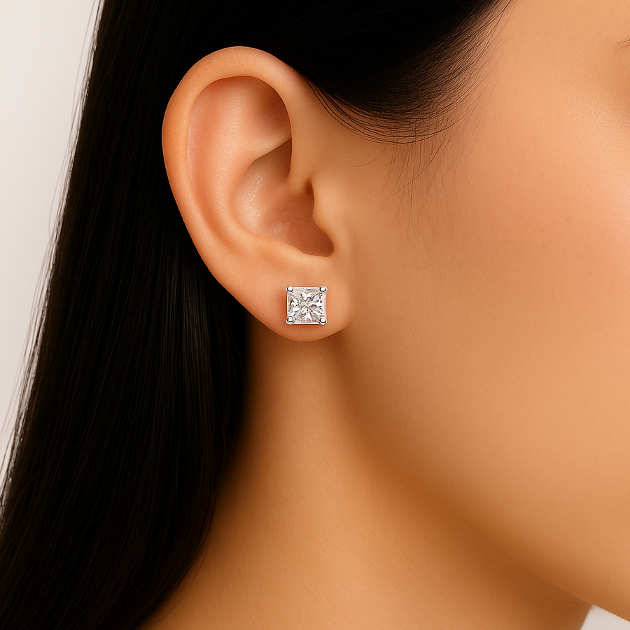 Princess cut moissanite stud earring shown on ear close-up view