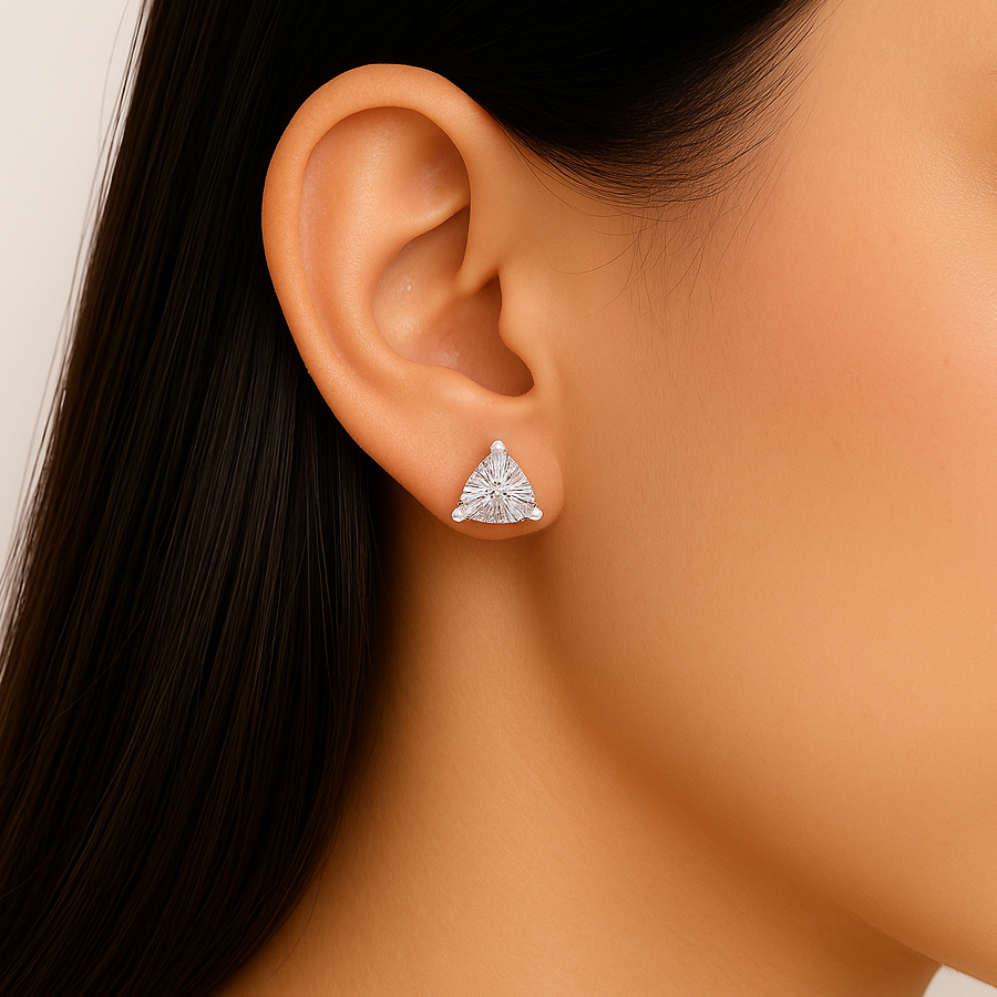 Trilliant cut moissanite stud earring on ear close-up view