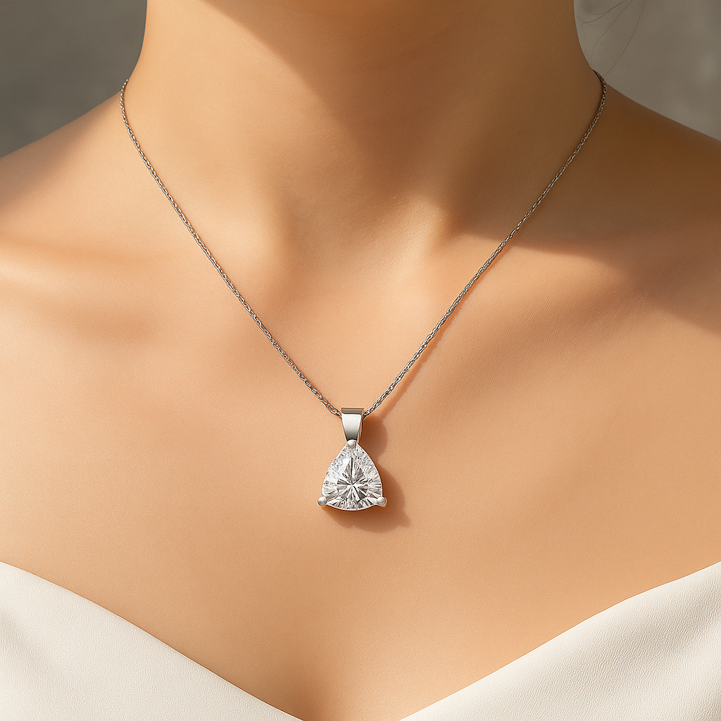 Trilliant cut moissanite pendant necklace worn close-up on model’s neck